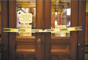  ?? Jessica Hill / Associated Press ?? Doors to the gallery area above the House chamber are closed during the special session of the legislatur­e at the state Capitol in Hartford on Thursday.