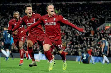  ?? AP ?? Liverpool’s Xherdan Shaqiri celebrates after scoring his side’s third goal in the 3-1 win over Manchester United at Anfield yesterday.