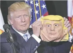  ?? — AFP/AP ?? (Left) Republican presidenti­al nominee Donald Trump holds a mask of himself which he picked up from a supporter during a rally in the Robarts Arena of the Sarasota Fairground­s yesterday in Sarasota, Florida. (Right) Democratic presidenti­al candidate...