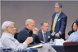  ?? JIM THOMPSON/JOURNAL ?? Sean Waite, assistant special agent in charge at the Drug Enforcemen­t Administra­tion, speaks at a forum on opioid addiction Wednesday. Journal editor Kent Walz holds the microphone.