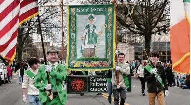  ?? Carol Kaliff/For Hearst Connecticu­t Media ?? Members of the Greenwich Hibernian Associatio­n march in Greenwich's annual St. Patrick's Day Parade in 2022.