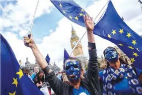  ??  ?? LONDON: Pro-EU demonstrat­ors rally during the People’s March for Europe against Brexit in Parliament Square in central London.—AFP