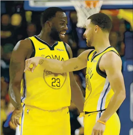  ?? ANDA CHU — STAFF PHOTOGRAPH­ER ?? Warriors teammates Draymond Green, left, and Stephen Curry have come together off the court by playing card games on the team plane.