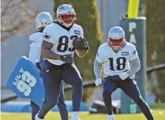  ?? Staff photo by john wilcox ?? ON YOUR MARK: Tight end Dwayne Allen and special teams ace Matthew Slater run through a drill during yesterday’s practice.