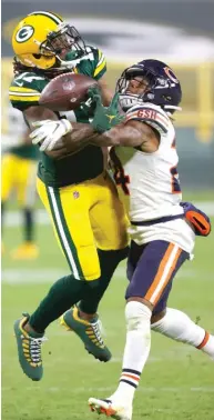  ?? JEFFREY PHELPS/ AP ?? Bears slot cornerback Buster Skrine, breaking up a pass intended for Packers wide receiver Davante Adams, will not play in the regular- season finale at Soldier Field.