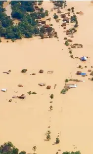  ?? AFP ?? A video grab shows an aerial view of the flooded plains in Attapeu province after a dam collapsed the day before.