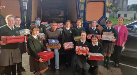  ??  ?? St Malachy’s Girls NS and principal Briege Galligan with some of the Christmas Shoeboxes which Conor Hughes collected.