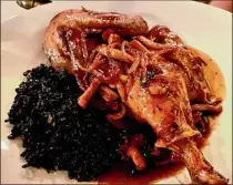  ?? ?? Roasted chicken with black forbidden rice at the Iron & Grass chophouse.