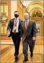  ?? Joshua Roberts/pool/afp via
Getty/tns ?? Trump attorney David Schoen (right) walks with an aide during a break in the impeachmen­t trial of former President Donald Trump, on charges of inciting the deadly attack on the U.S. Capitol, on Capitol Hillon Wednesday.