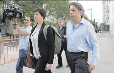  ?? Mary Altaffer Associated Press ?? AARON DAVIDSON, right, leaves federal court Friday after pleading not guilty to racketeeri­ng, money laundering and wire fraud in the case involving organizers of the Copa America soccer tournament.