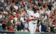  ?? MICHAEL DWYER - THE ASSOCIATED PRESS ?? FILE - In this Oct. 8, 2017, file photo, Boston Red Sox’s Rafael Devers tosses his bat after hitting a two-run home run against the Houston Astros during the third inning in Game 3of baseball’s American League Division Series, in Boston. Third baseman...