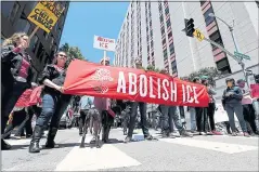  ?? RAY CHAVEZ — STAFF PHOTOGRAPH­ER ?? Dozens of demonstrat­ors protest outside ICE headquarte­rs in San Francisco in June. A coalition is calling on Bay Area cities and counties to boycott tech companies that provide data sharing services to ICE.