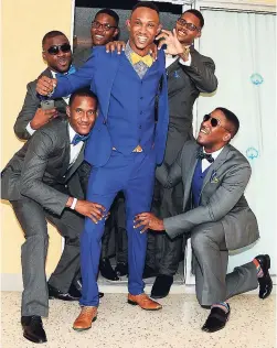  ??  ?? Sean Taylor is 'swagged' up by his groomsmen (from left) Ronnel Kelly, Duane West, Daniel and David Perry, and bestman, Paul Grant.