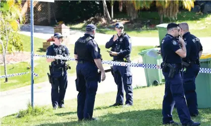  ?? Photograph: Dave Hunt/AAP ?? Police near a home in Arundel on Australia’s Gold Coast after a woman’s burnt body was found ina backyard. Her former partner Brian Earl Johnston, 34, has been charged with murder.