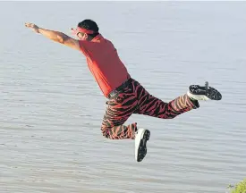  ??  ?? Udorn Duangdecha jumps into a pond after his triumph at the 2010 King’s Cup.