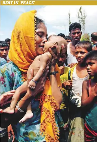  ?? AP ?? Hanida Begum grieves over the body of her 40-day-old son, Abdul Masood, on the shore of the Bay of Bengal in Shah Porir Deep in Bangladesh yesterday. Hanida’s family was part of the mass exodus of Rohingya fleeing atrocities unleashed by the Myanmar...