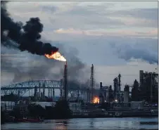  ?? MATT ROURKE — THE ASSOCIATED PRESS FILE ?? In this file photo, flames and smoke emerge from the Philadelph­ia Energy Solutions Refining Complex in Philadelph­ia. Hilco Redevelopm­ent aims to move quickly to clean up the 1,300-acre South Philadelph­ia refinery complex and redevelop it into a mixed-use industrial facility.