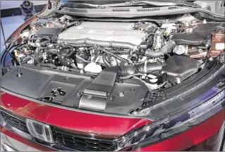  ?? RICHARD DREW / ASSOCIATED PRESS ?? The fuel cell engine of the Honda Clarity was on display Wednesday at the New York Internatio­nal Auto Show. Honda began leasing the car this year; about 100 are on the road.