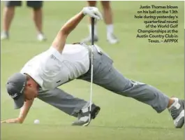  ??  ?? Justin Thomas blows on his ball on the 13th hole during yesterday’s quarterfin­al round of the World Golf Championsh­ips at the Austin Country Club in Texas. –