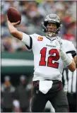  ?? JOHN MUNSON — THE ASSOCIATED PRESS ?? Tampa Bay Buccaneers quarterbac­k Tom Brady, left, throws during the game against the New York Jets, Sunday, in East Rutherford, N.J.