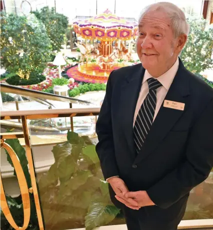  ?? CHRIS CHRISTO / HERALD STAFF ?? Dan McDermott stands ready to give directions or take a few photos for guests at the Encore Boston Harbor casino in Everett.