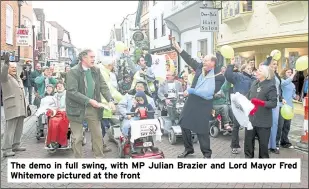  ?? ?? The demo in full swing, with MP Julian Brazier and Lord Mayor Fred Whitemore pictured at the front