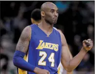  ?? AP FILE PHOTO RICK BOWMER ?? Los Angeles Lakers forward Kobe Bryant walks onto the court during the team's NBA basketball game against the Utah Jazz in Salt Lake City. The Lakers announced Tuesday that they will retire Bryant’s No. 8 and No. 24 in a ceremony Dec. 18 during their...