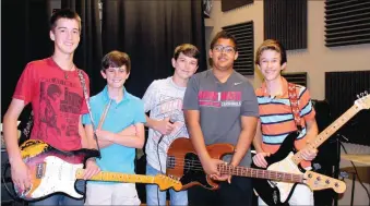  ?? LYNN KUTTER ENTERPRISE-LEADER ?? Trey Waggle, left, Coleman Warren, Jake Phillips, Quincy Graves and Sam Shaw make up the band Xcluded. The boys, all 14 years old, are in eighth grade at Lynch Middle School in Farmington. They will have a release party for their first album at 7 p.m....