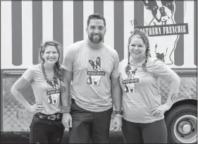  ??  ?? Hitting the road for The Great Food Truck Race is Little Rock chef Donnie Ferneau, his wife, Meaghan (left) and sous chef Amanda Ivy. The race begins at 8 p.m. today on Food Network.