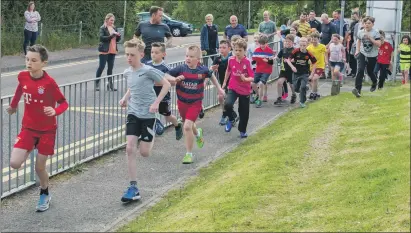  ??  ?? And they’re off ! The pupils set off on their annual fundraisin­g fun run.