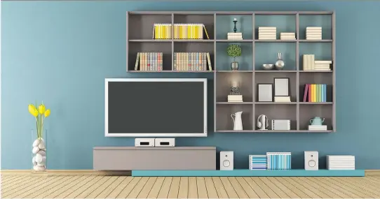  ?? GETTY IMAGES ?? A 3D rendering of a modern lounge with wall unit and television. An affordable approach: Fill a wall with individual shelves arranged around the television. “Use floating shelves or shelves with really beautiful brackets,” says Marianne Canada, digital...