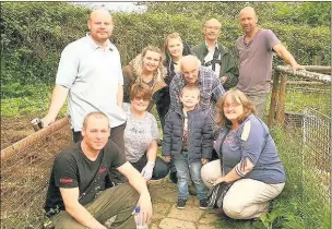  ??  ?? n
PASSIONATE: Volunteers at the farm with Stan Atkins (also pictured below)