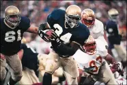  ?? JOE RAYMOND — THE ASSOCIATED PRESS FILE ?? Notre Dame back Ray Zellars (34) heads upfield during an NCAA college football game against Florida State in South Bend, Ind. on Nov. 13, 1993.