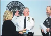  ?? TOMKELLYII­I— FOR DIGITAL FIRSTMEDIA ?? District Judge Walter Gadzicki Jr. swears in new Limerick Police Chief Brian Skelton during a ceremony Tuesday evening. Holding the Bible is Skelton’swife, Penny.