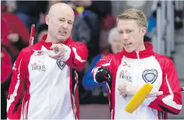  ??  ?? Team Canada skip Kevin Koe, left, and third Marc Kennedy have their team off to a 4-2 start at the Tim Hortons Brier in St. John’s.