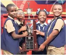  ?? FILE PHOTOS ?? Kevi-Ann Rose (third left) poses with the Junior Schools’ Challenge Quiz with members of her winning George Headley Primary team (from left), Jair Simms, Jamal Doctor, and Dominic Morgan.