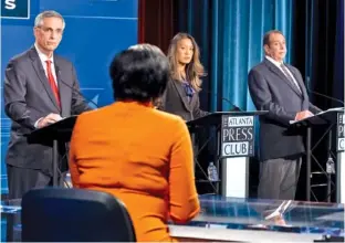  ?? AP PHOTO/BEN GRAY ?? From left, Georgia Secretary of State Brad Raffensper­ger, Democratic challenger Bee Nguyen and Libertaria­n challenger Ted Metz debate in October during the Atlanta Press Club Loudermilk-Young Debate Series in Atlanta.