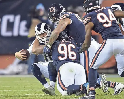  ?? QUINN HARRIS/USA TODAY SPORTS ?? Rams quarterbac­k Jared Goff is sacked by Bears defensive end Akiem Hicks at Soldier Field. The Bears’ defense limited the high-powered Los Angeles offense to a pair of field goals on Sunday night.