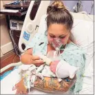  ?? Melissa Syverson / Associated Press ?? Kristen McMullen, 30, feeds her newborn daughter, Summer, at Holmes Regional Medical Center in Melbourne, Fla. Kristen only got to hold Summer for a few moments after giving birth via emergency C-section. The mother, who had COVID-19, was then taken to the ICU. She died on Aug. 6, 10 days after her little girl was born.