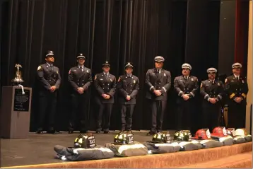  ?? ?? From left, Engineer Luis Rivera, Engineer Jason Vander Meer, Engineer Jian Eddinger, Engineer Justin Duchscher, Capt. Dean Martin, Capt. Japen Soto, Capt. Ryan Esparza and Division Chief Brian Kermoade stand on stage at the conclusion of their badge-pinning ceremony Friday at the Kroc Center in Suisun City.