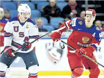  ?? NATHAN DENETTE/THE CANADIAN PRESS ?? United States’ forward Casey Mittelstad­t and Russian forward Mikhail Maltsev vie for the puck earlier this month at the IIHF World Junior Hockey Championsh­ips in Buffalo, N.Y. When the offensivel­y challenged Sabres left town for two weeks to make way...