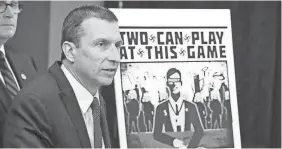  ?? TED S. WARREN/AP ?? Raymond Duda, FBI Special Agent in Charge in Seattle, stands next to a poster that was mailed to the home of reporter Chris Ingalls.