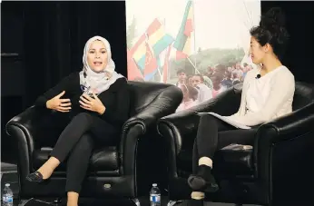  ?? MATT OLSON ?? Dr. Alaa Murabit, UN High-Level Commission­er on Health Employment and Economic Growth, and Grade 12 student Jiaqi Shang discuss being good citizens while onstage Friday at Evan Hardy Collegiate.