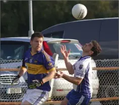  ??  ?? Aaron Kehoe (St. Mary’s, Rosslare) and Patrick Lancaster (Craanford) contest possession in Saturday’s JBFC semi-final in Hollymount.