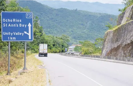  ?? IAN ALLEN/PHOTOGRAPH­ER ?? A truck proceeds downhill on a section of Edward Seaga Highway on June 12.