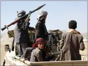  ?? THE ASSOCIATED PRESS ?? Houthi fighters and tribesmen stage a rally against American and British trikes on Houthi-run military sites near Sana, Yemen, on Sunday.