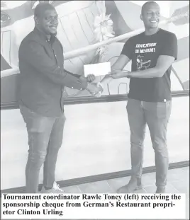  ?? ?? Tournament coordinato­r Rawle Toney (left) receiving the sponsorshi­p cheque from German’s Restaurant proprietor Clinton Urling