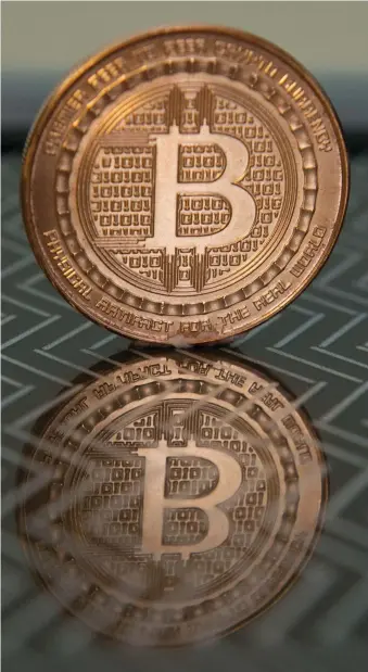  ?? AFP ?? Bitcoin has made its debut on a major exchange, a huge milestone for the digital currency