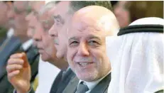  ?? — AFP ?? Iraqi Prime Minister Haider al Abadi (C) during the Kuwait internatio­nal conference for the reconstruc­tion of Iraq in Kuwait City on Tuesday.