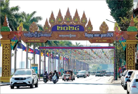  ?? ?? A view of preparatio­ns for the New Year on Sisowath Quay near the Royal Palace in Phnom Penh on December 31, 2023.